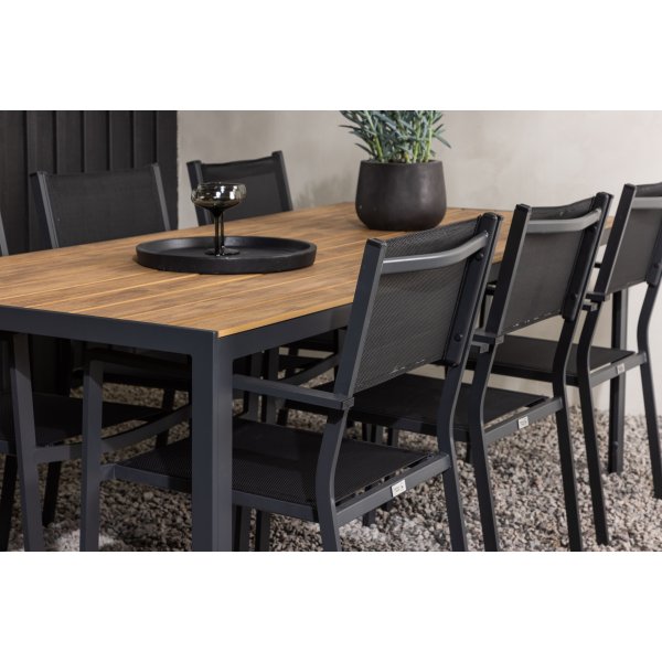 Matvaregruppen i Chania; 6 stoler med bord 205 x 90 cm - Svart/natur Matvaregruppen i Chania; 6 stoler med bord 205 x 90 cm - Svart/natur